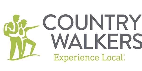 Illustration of two hikers pointing at the name Country Walkers, with the tagline "Experience Local" below.